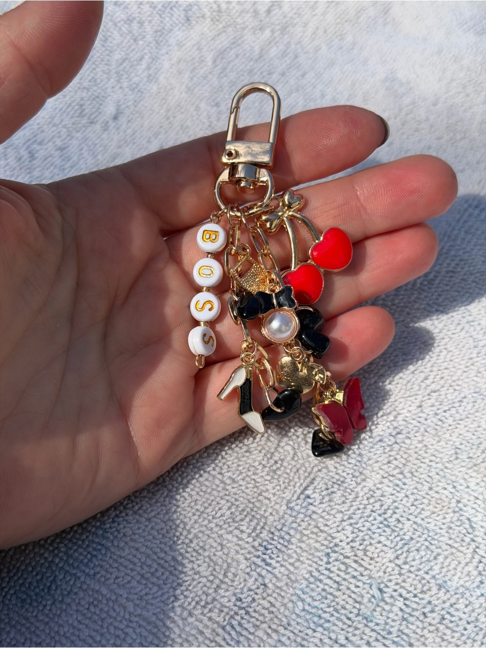 Charming Gold bag charm with obsidian stone